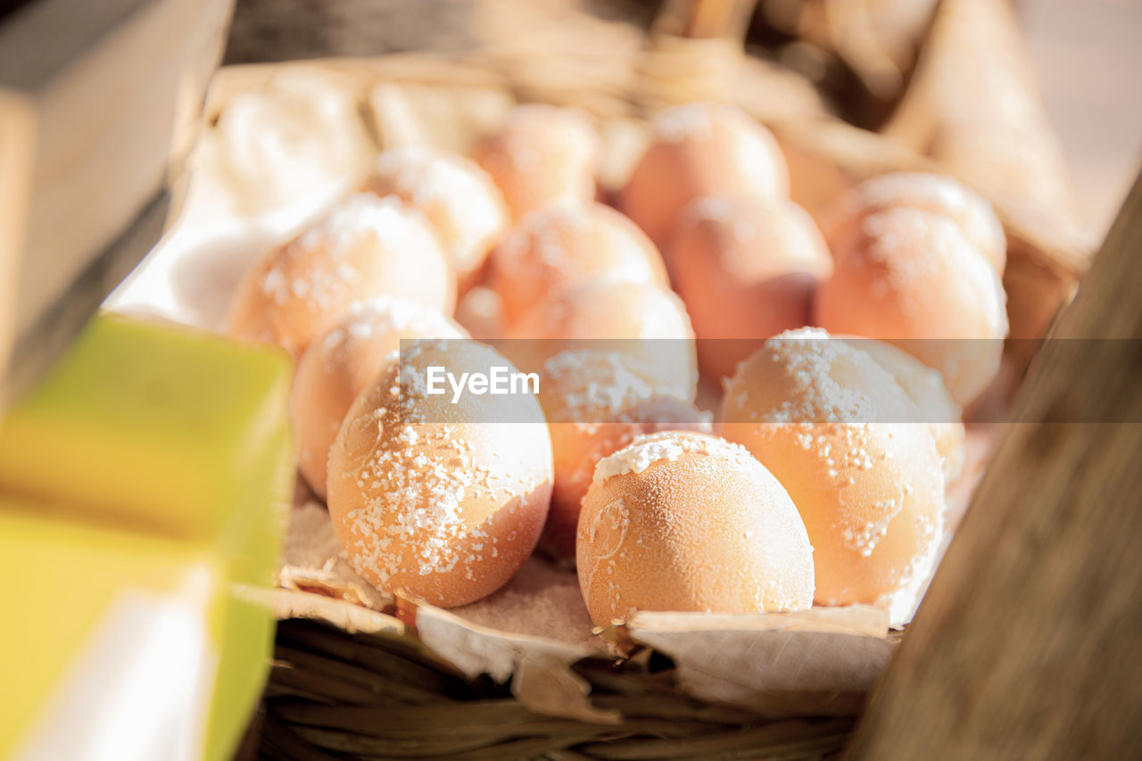 Eggs of salt on plate with sunlight in countryside.