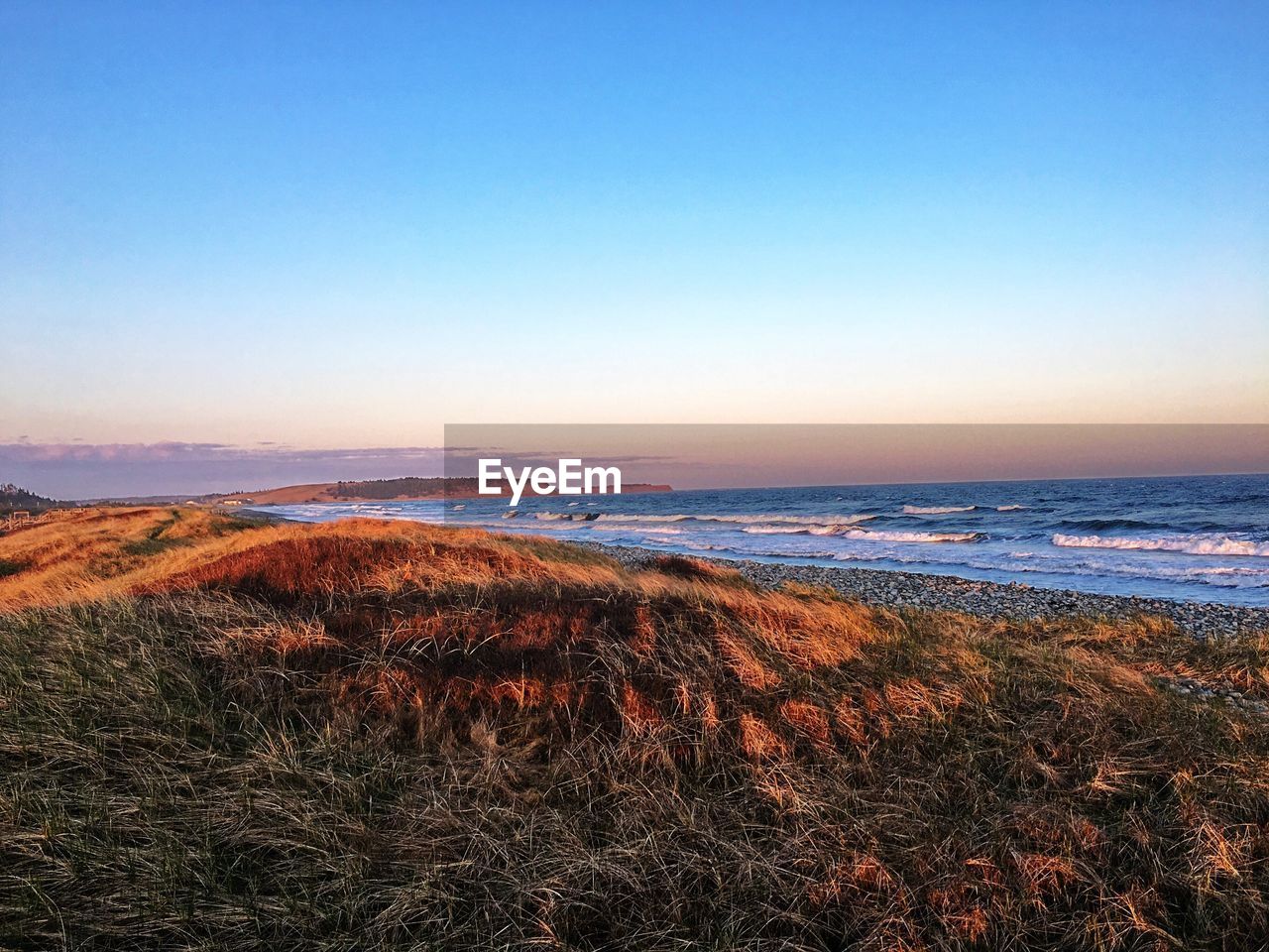 Scenic view of sea against clear sky