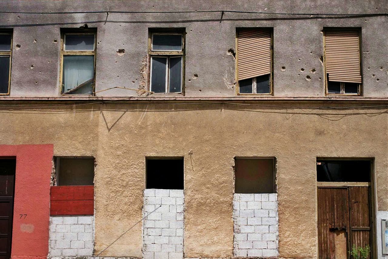 Low angle view of built structure with windows