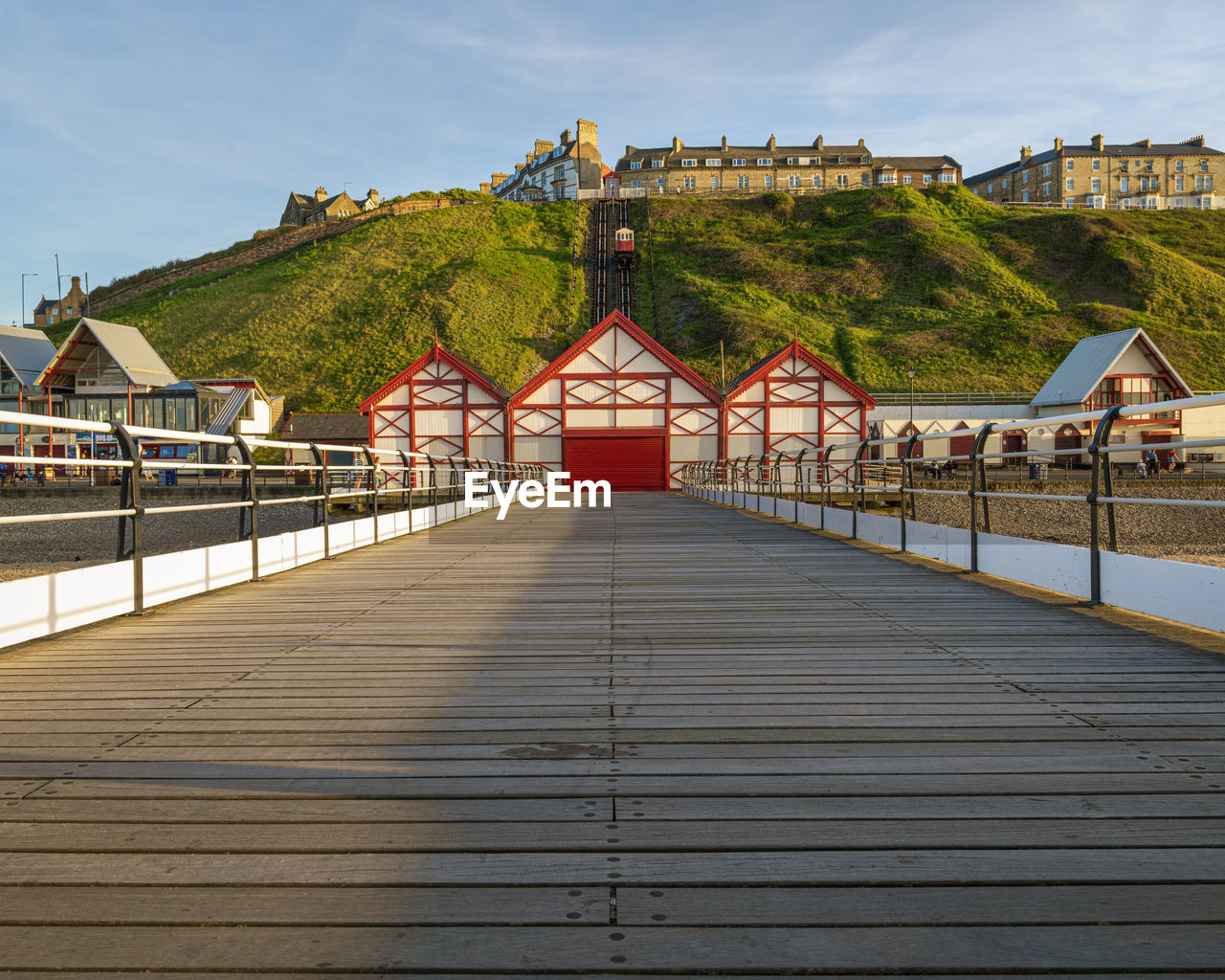 Saltburn by the sea pier looking towards the cliff lift which dates from 1884