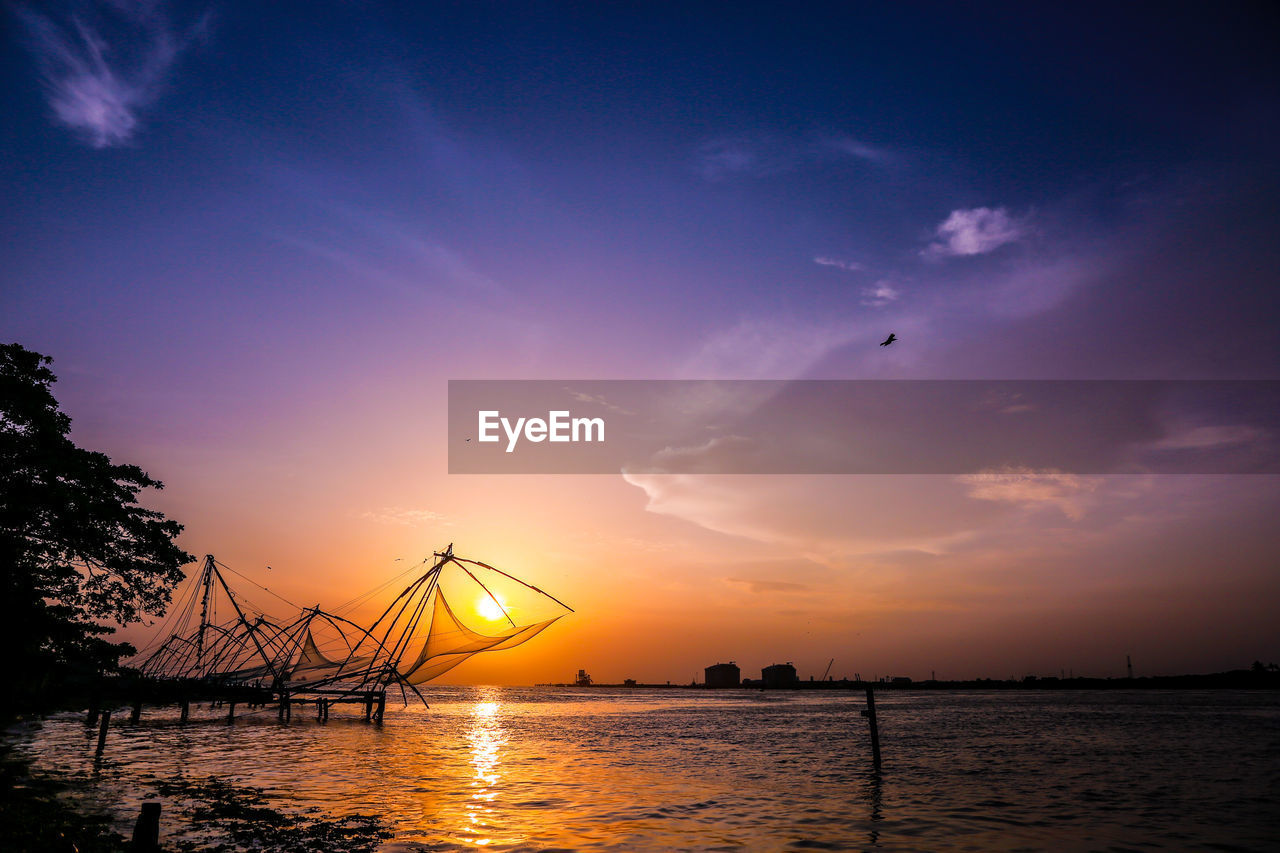 View of calm lake at sunset