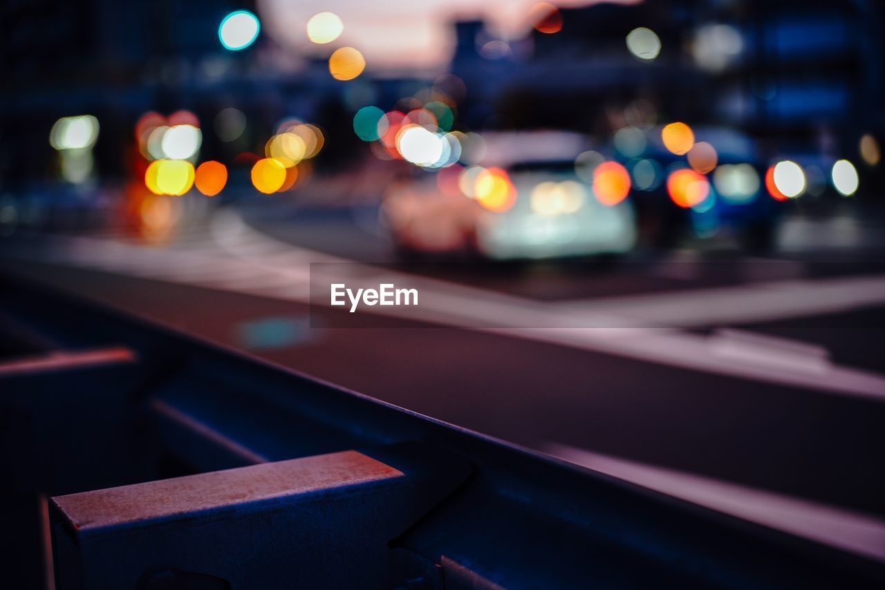 Defocused image of traffic on road at night