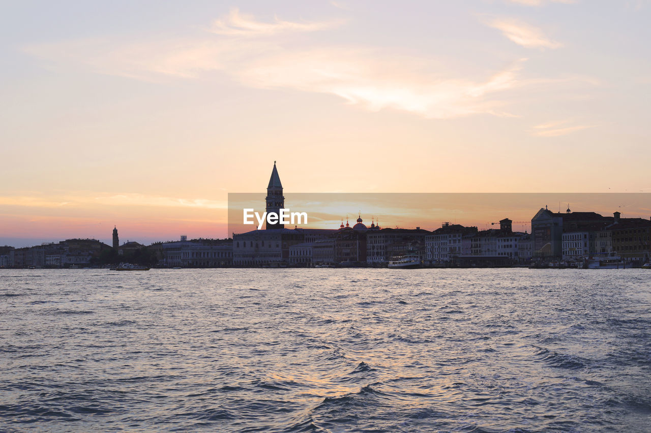 View of buildings against sky during sunset