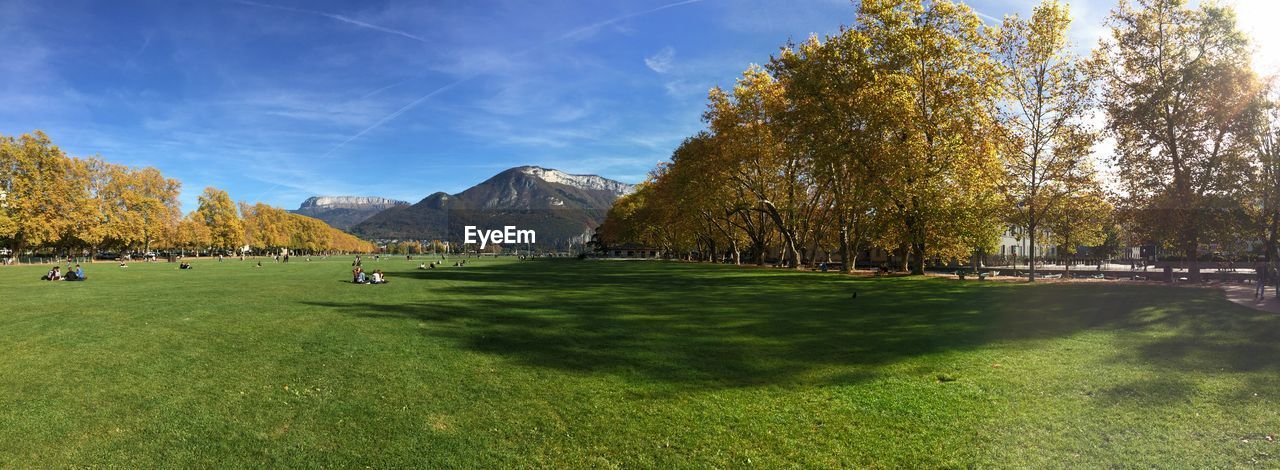 SCENIC VIEW OF LANDSCAPE AND MOUNTAINS AGAINST SKY