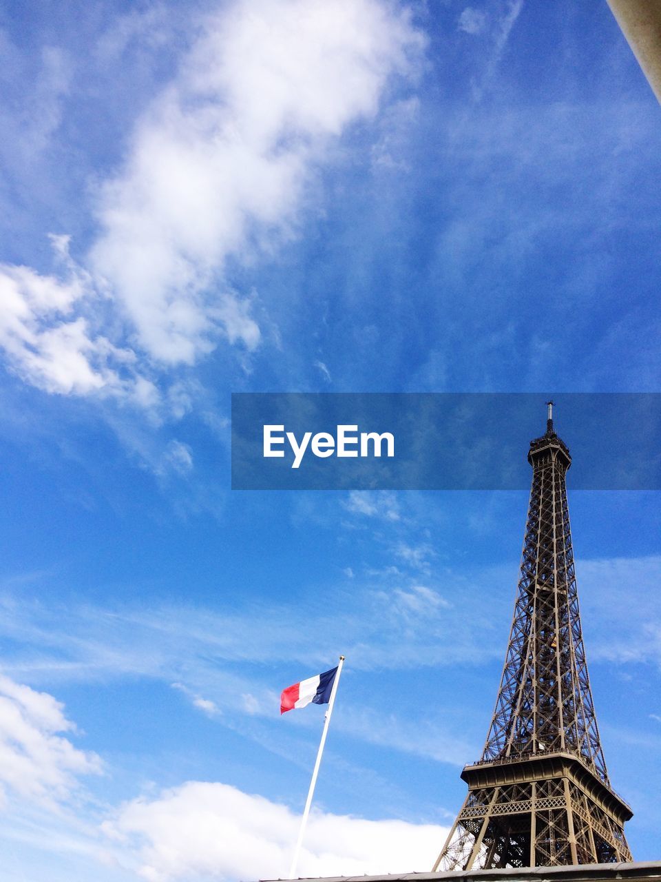 Low angle view of eiffel tower against blue sky