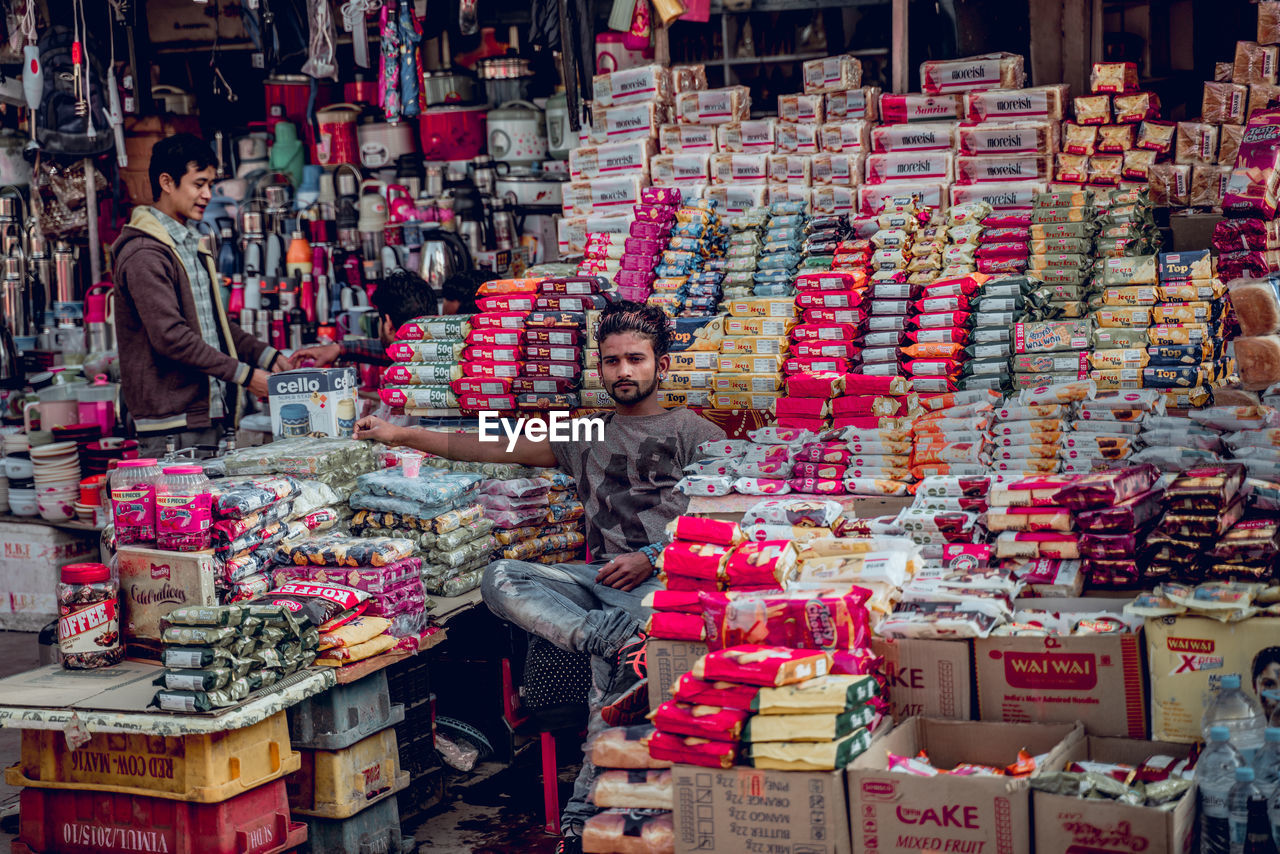 PEOPLE AT MARKET STALL