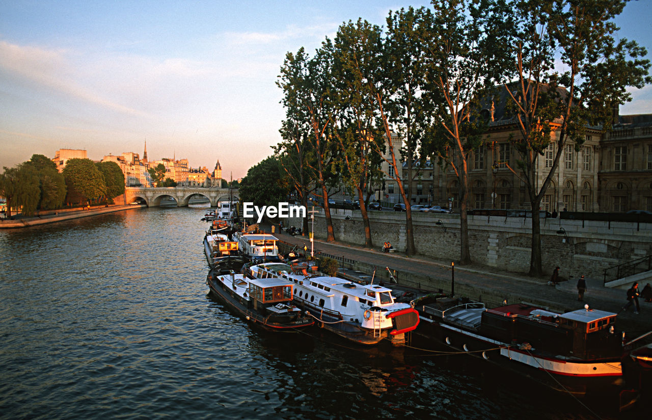 BOATS SAILING ON RIVER