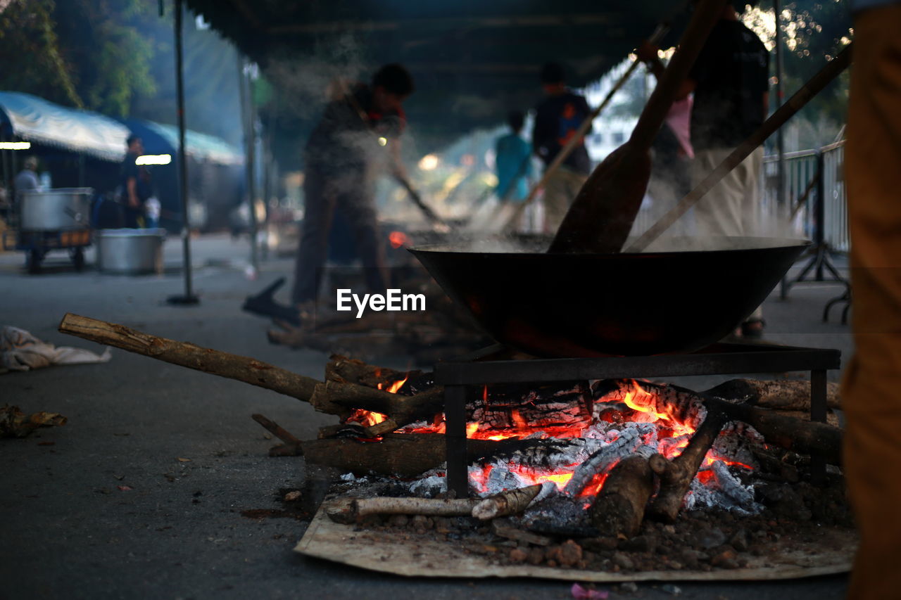 High angle view of people on barbecue grill