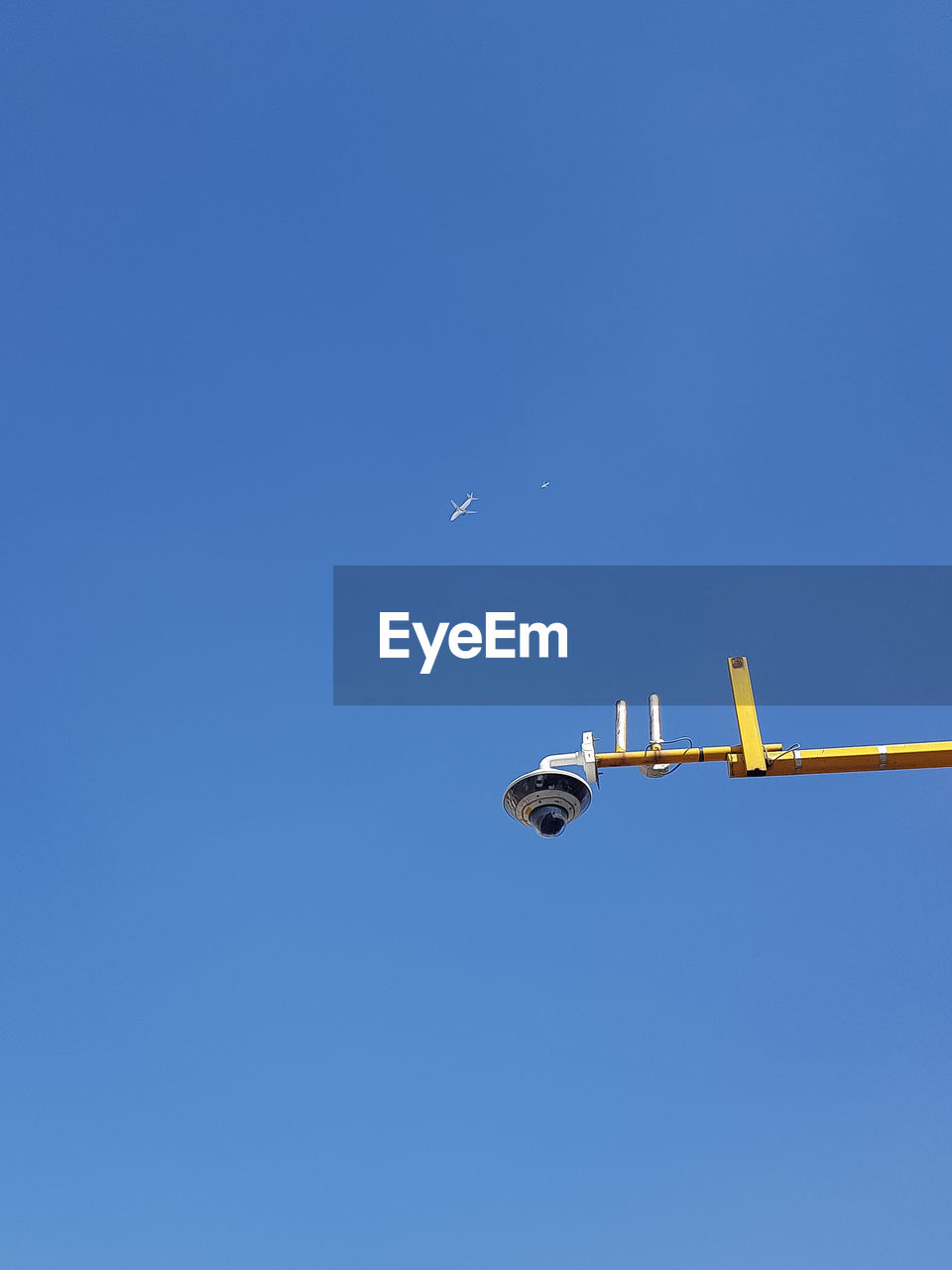 LOW ANGLE VIEW OF AIRPLANE AGAINST SKY