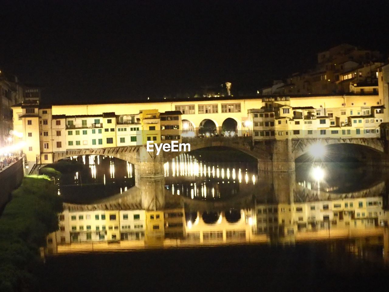 VIEW OF ILLUMINATED BUILDING AT NIGHT