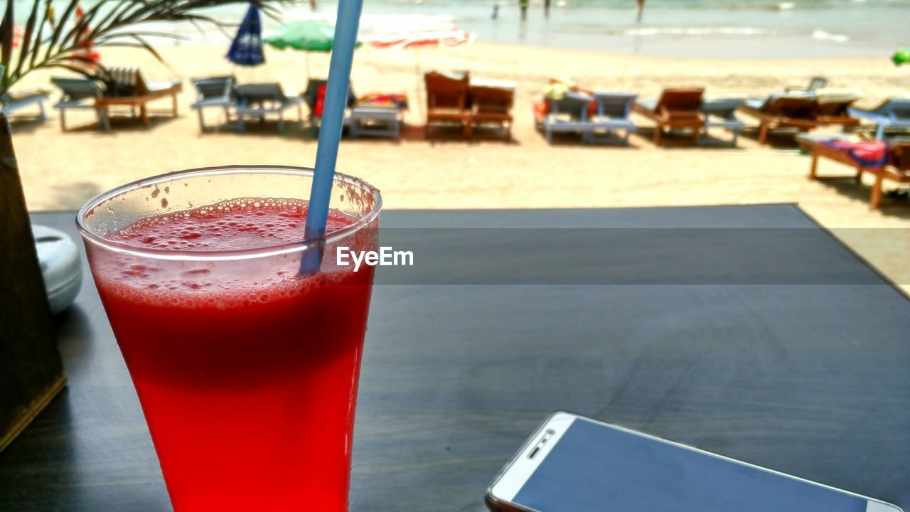 CLOSE-UP OF DRINK ON TABLE