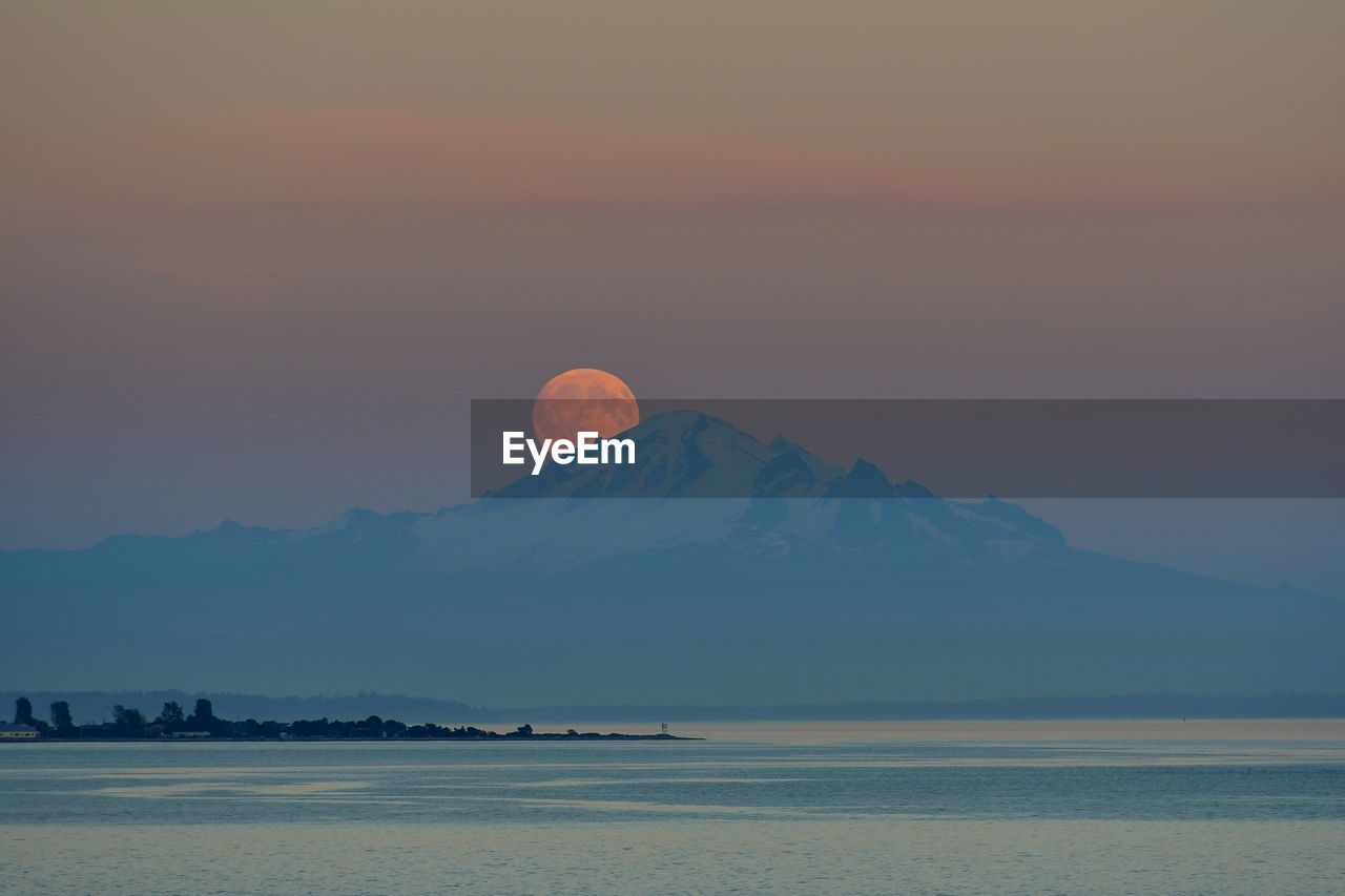 Moon with mountain in foreground