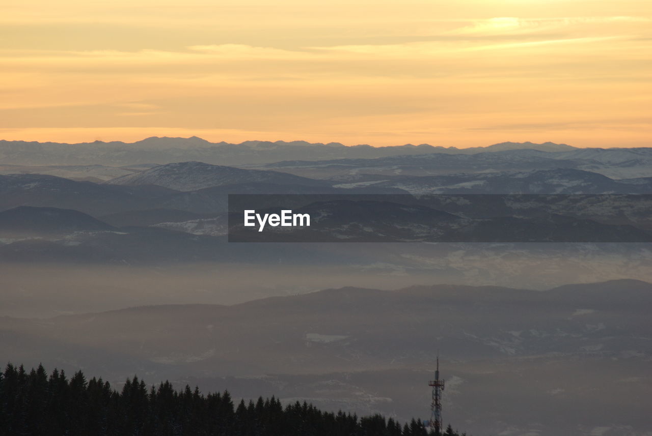 SILHOUETTE MOUNTAINS AGAINST SKY DURING SUNSET