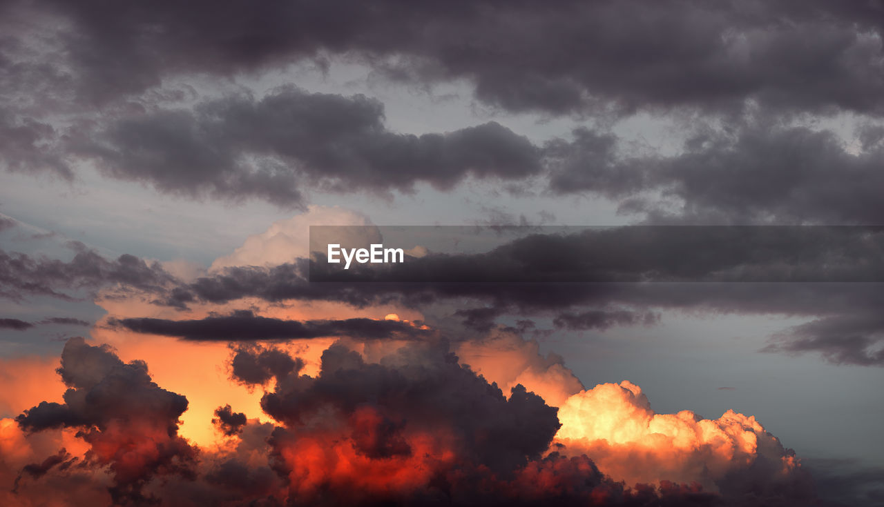 Low angle view of cloudy sky during sunset