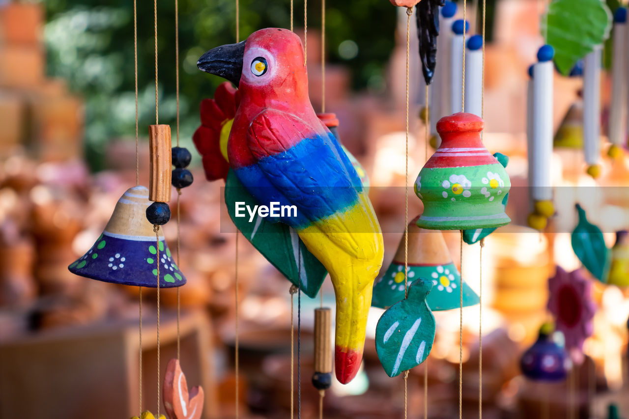 Close-up of wooden bird for sale in market