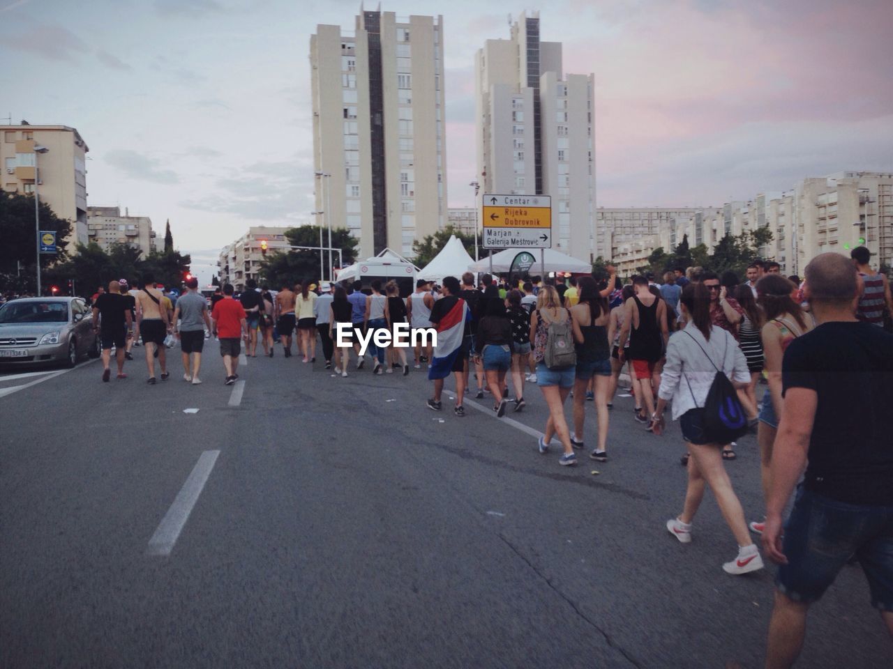 Crowd walking on city road