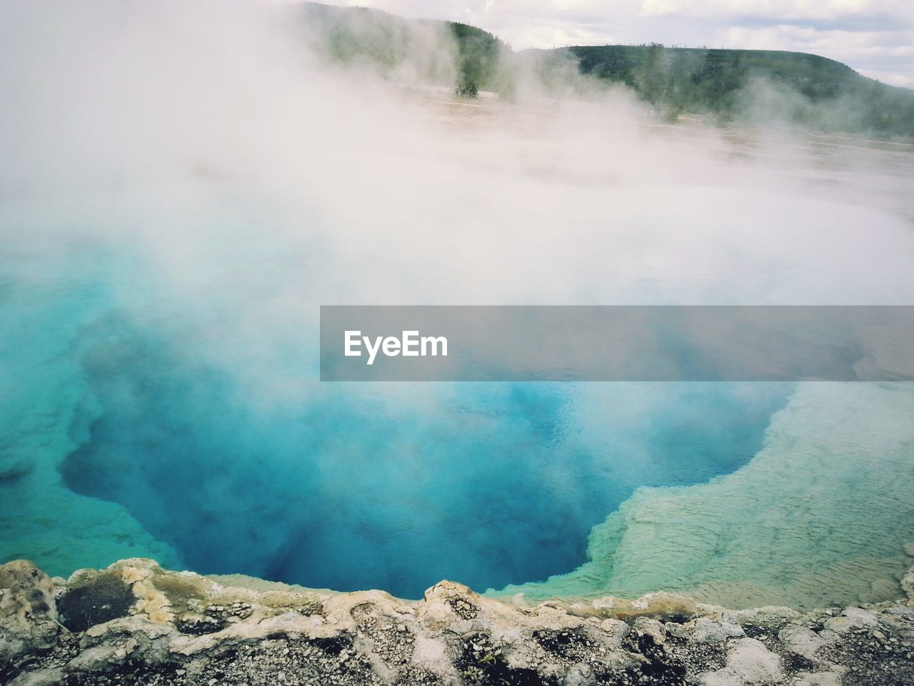 Steam emitting from sapphire pool at yellowstone national park