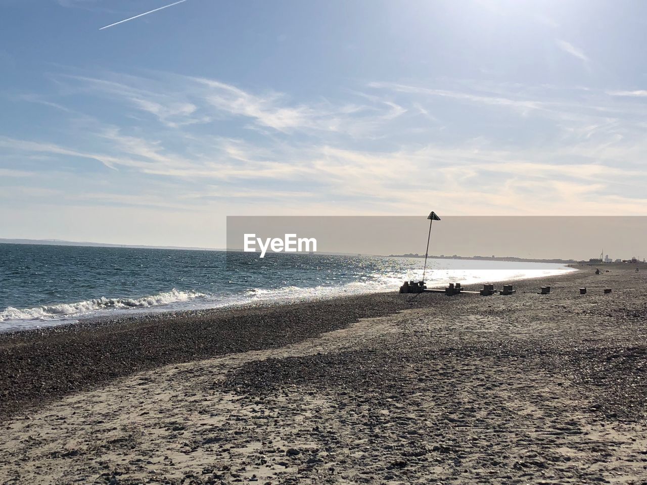 SCENIC VIEW OF SHORE AGAINST SKY