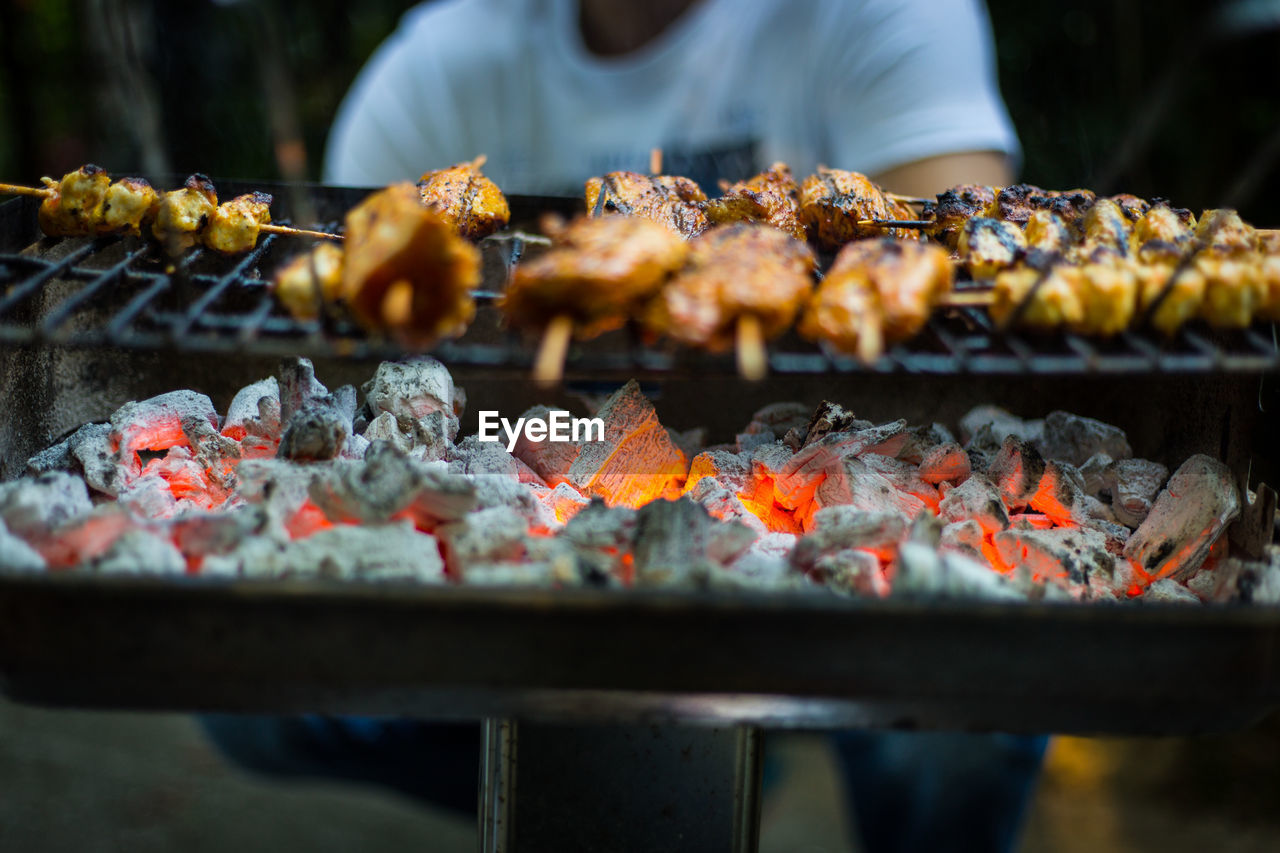 Midsection of man preparing food