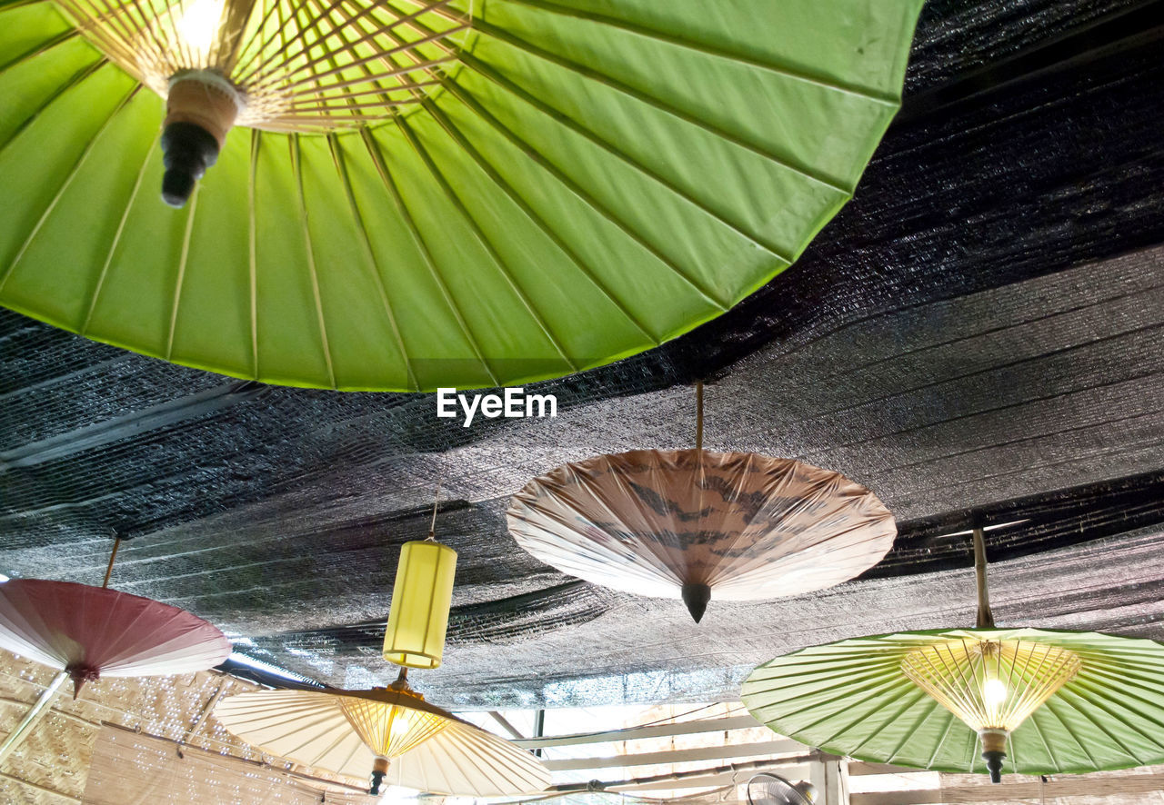 Low angle view of umbrellas at ceiling