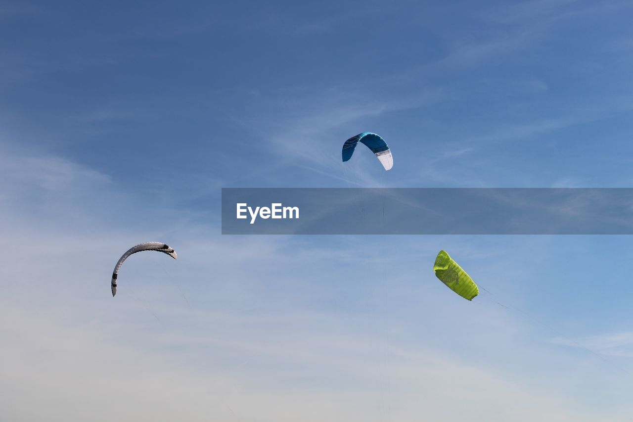 LOW ANGLE VIEW OF KITE FLYING IN SKY