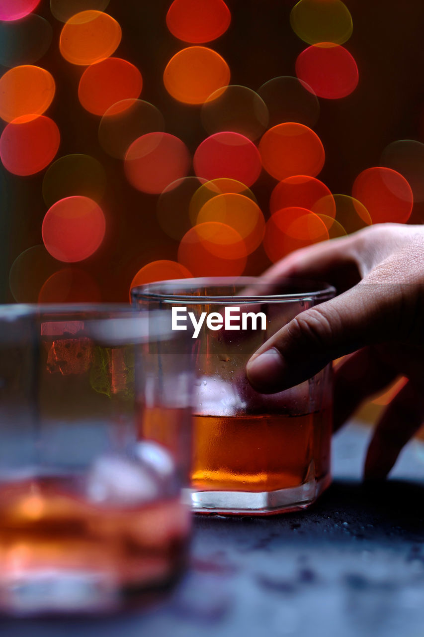 Close-up of hand holding wine glass