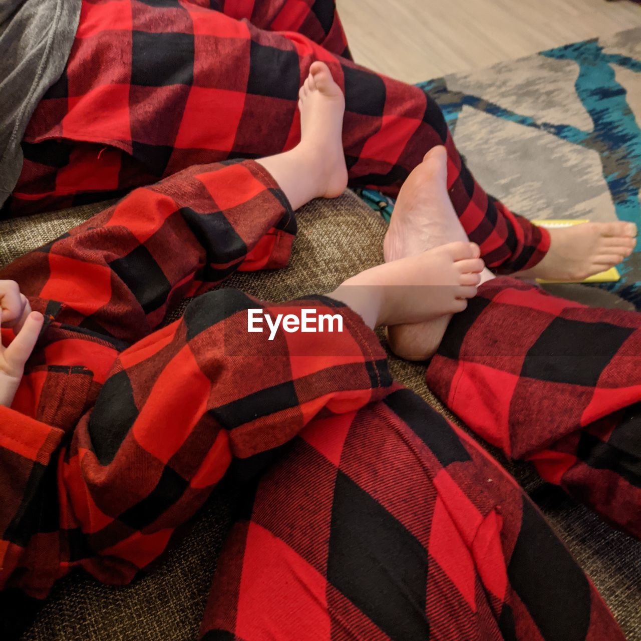 HIGH ANGLE VIEW OF WOMEN RELAXING ON BED