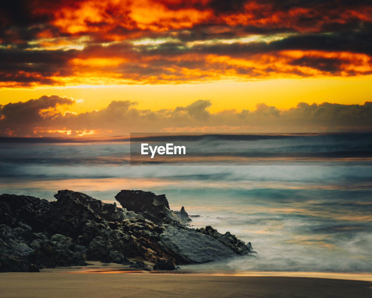 Scenic view of sea against sky during sunset