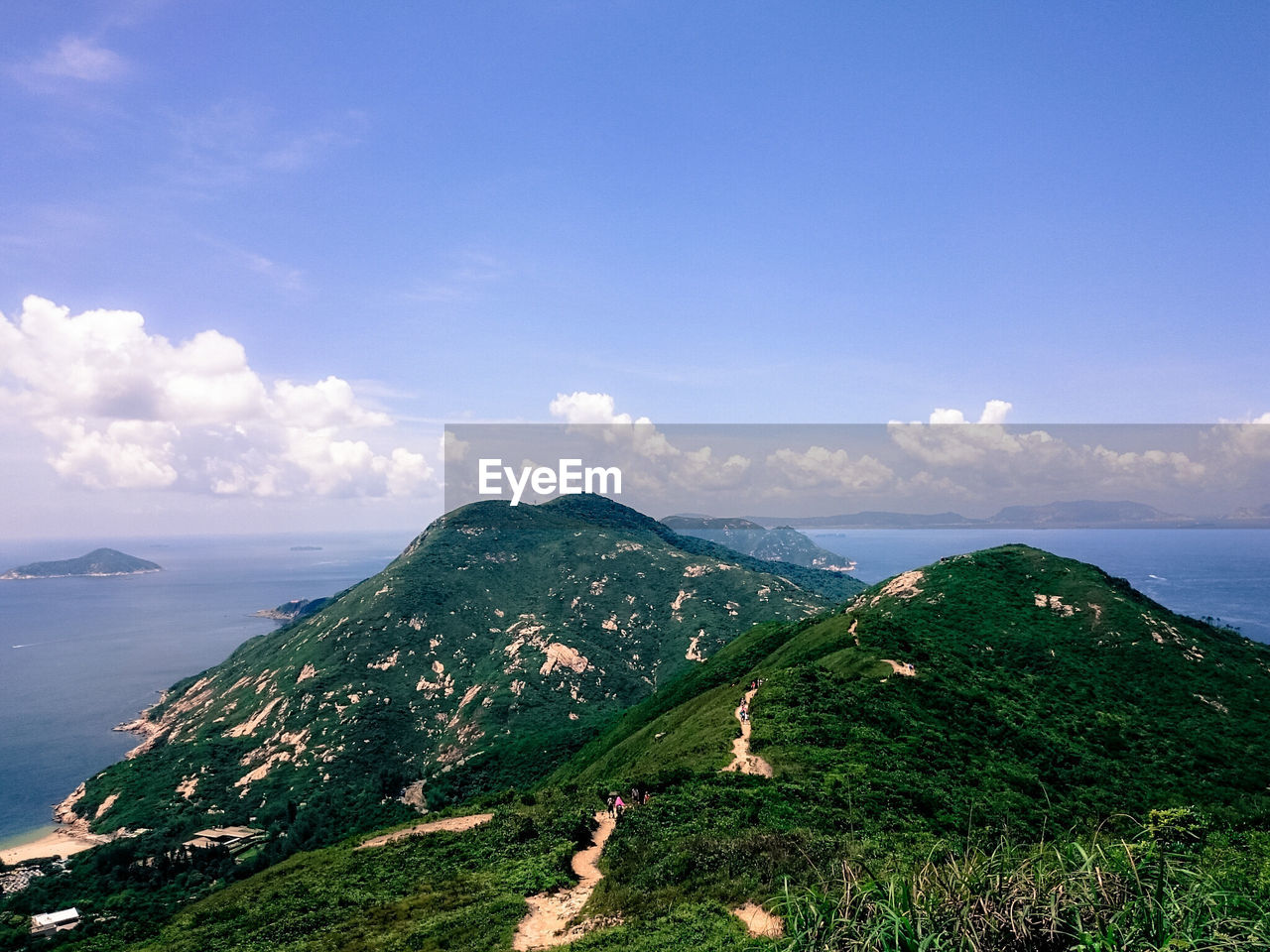 SCENIC VIEW OF MOUNTAINS AGAINST CLOUDY SKY