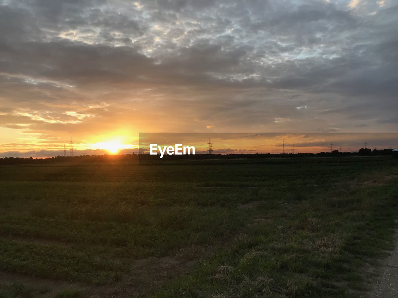 SCENIC VIEW OF SUNSET OVER LAND