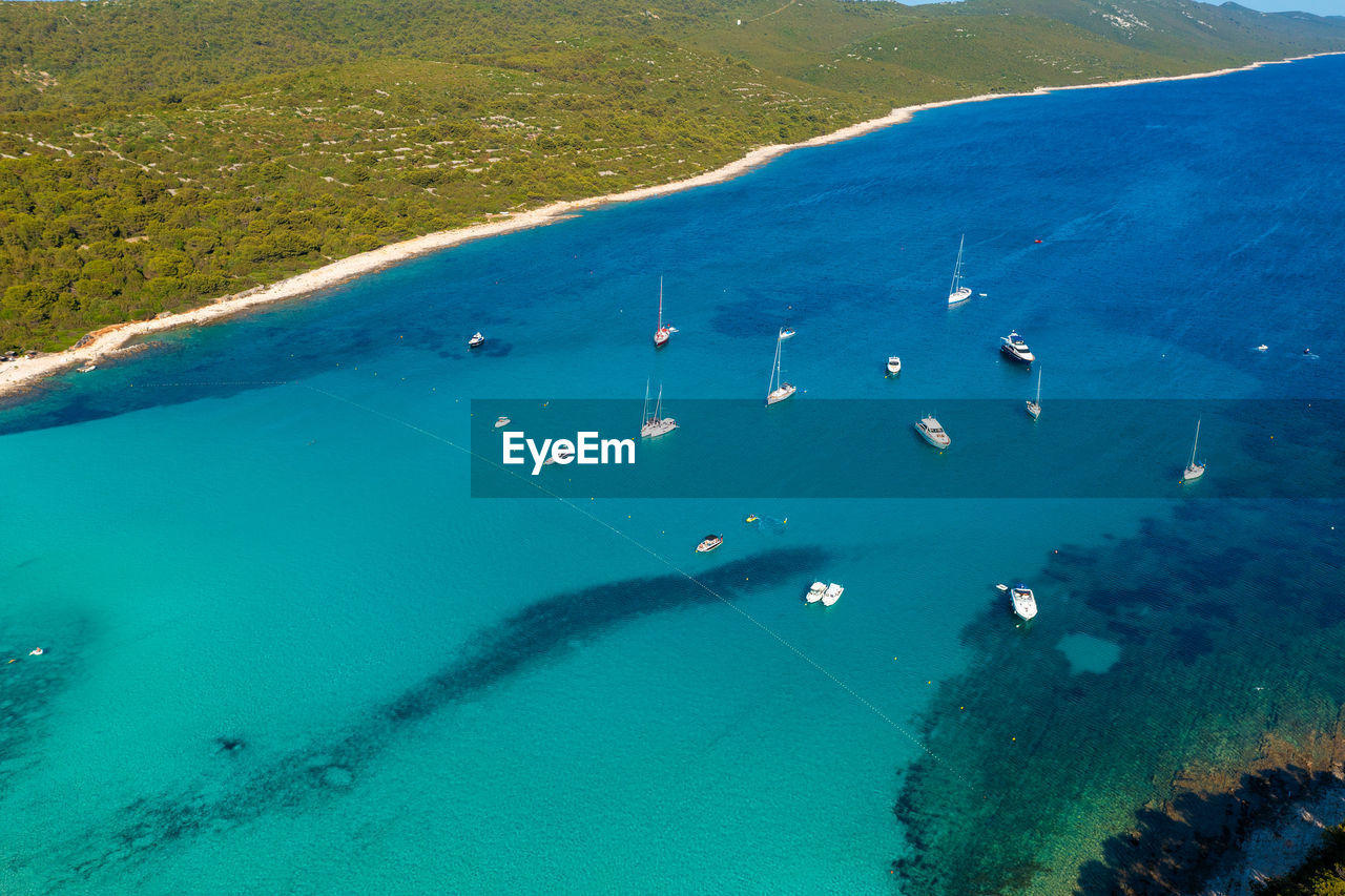 Aerial view of a beach with the boats on the sakarun beach, adriatic sea, croatia