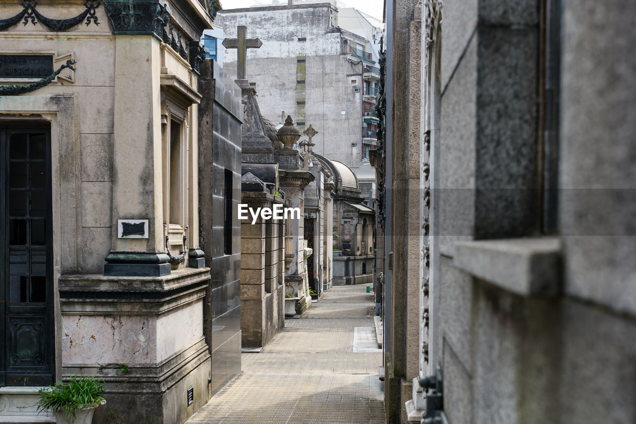 Walkway amidst buildings