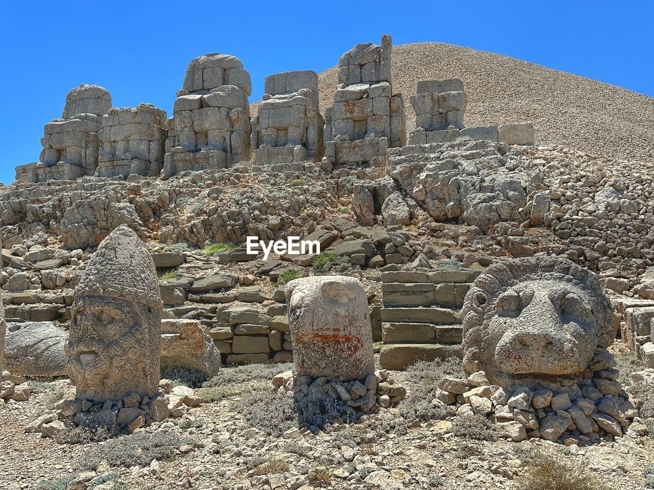 ruins, archaeological site, ancient history, history, rock, architecture, ancient, historic site, the past, travel destinations, nature, sky, no people, old ruin, travel, monument, built structure, ancient civilization, clear sky, land, temple, blue, landmark, day, outdoors, sunny, tourism, religion, archaeology, stone material, temple - building, sunlight