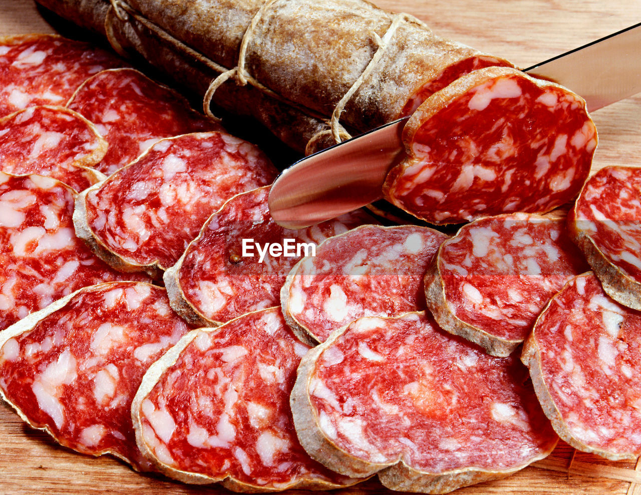 Sliced fresh salami, a traditional dried and cured italian sausage prepared from meat