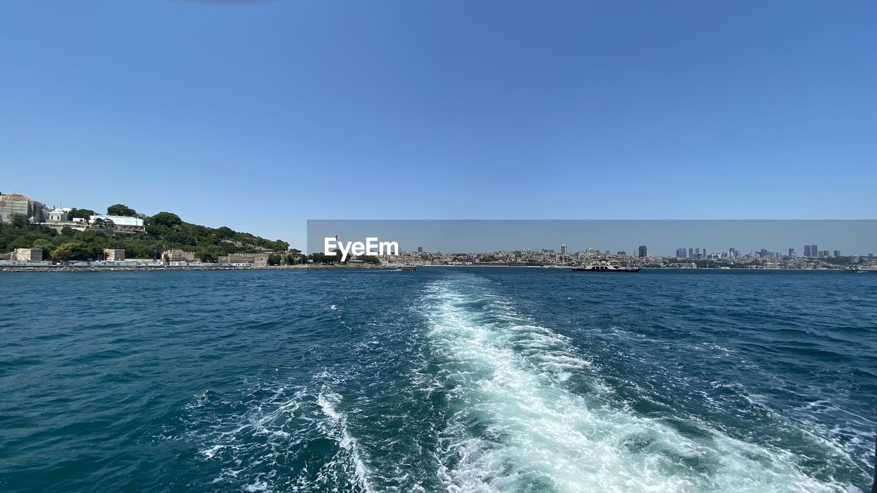 Scenic view of sea against clear blue sky