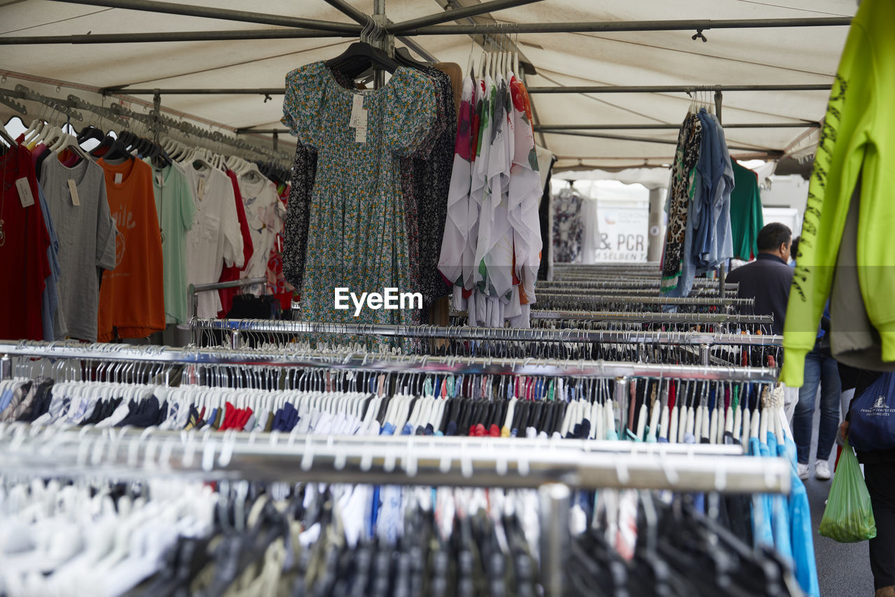 
selling clothes at a weekly market