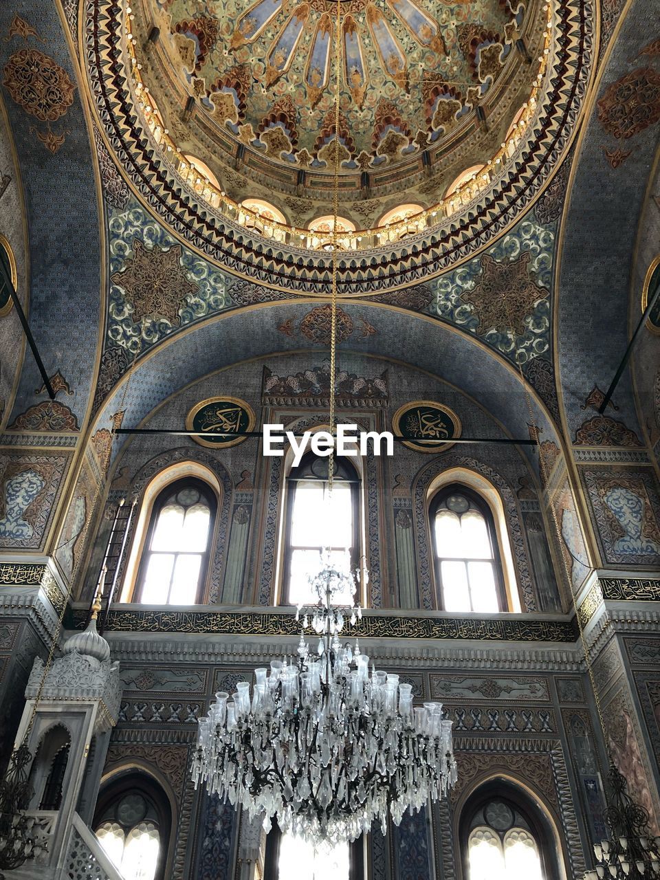 Low angle view of chandelier hanging from ceiling in cathedral