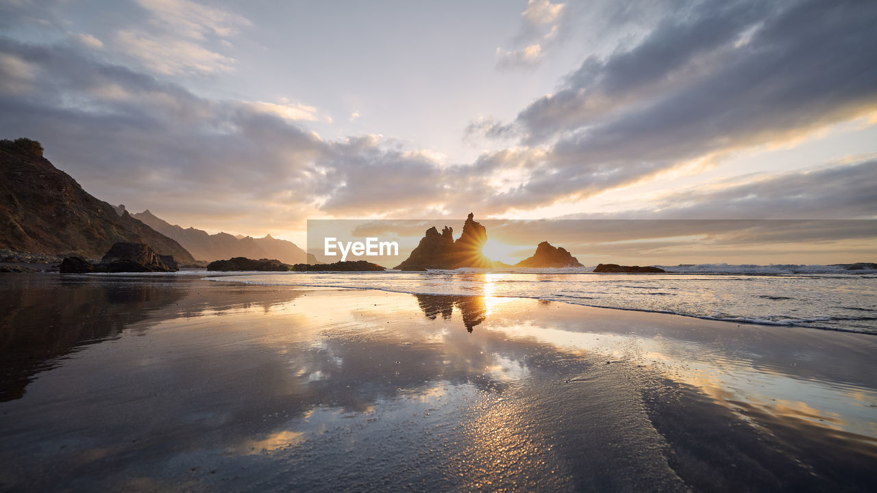 Scenic view of benijo beach against sky at beautiful sunset. tenerife, canary islands, spain.