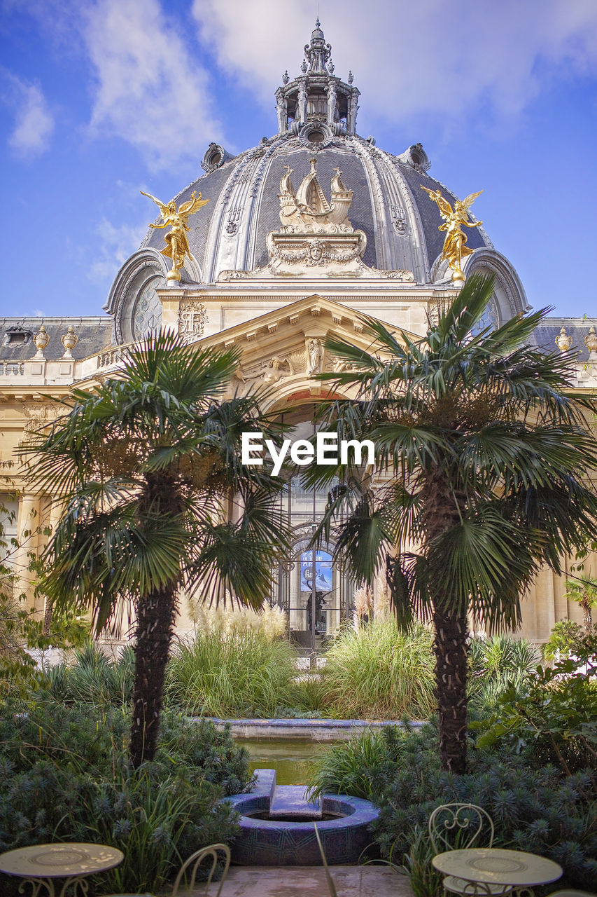 architecture, built structure, travel destinations, building exterior, sky, tropical climate, plant, nature, palm tree, tree, travel, estate, building, vacation, landmark, religion, no people, cloud, tourism, furniture, resort, belief, city, outdoors, history, blue, the past, palace, place of worship, day, spirituality, dome