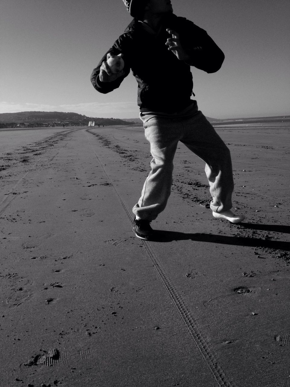 Man about to throw ball on beach