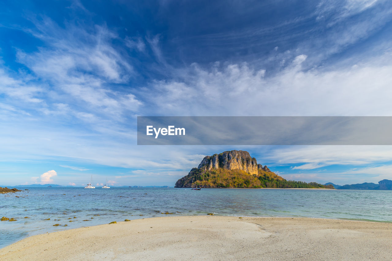 SCENIC VIEW OF BEACH AGAINST BLUE SKY