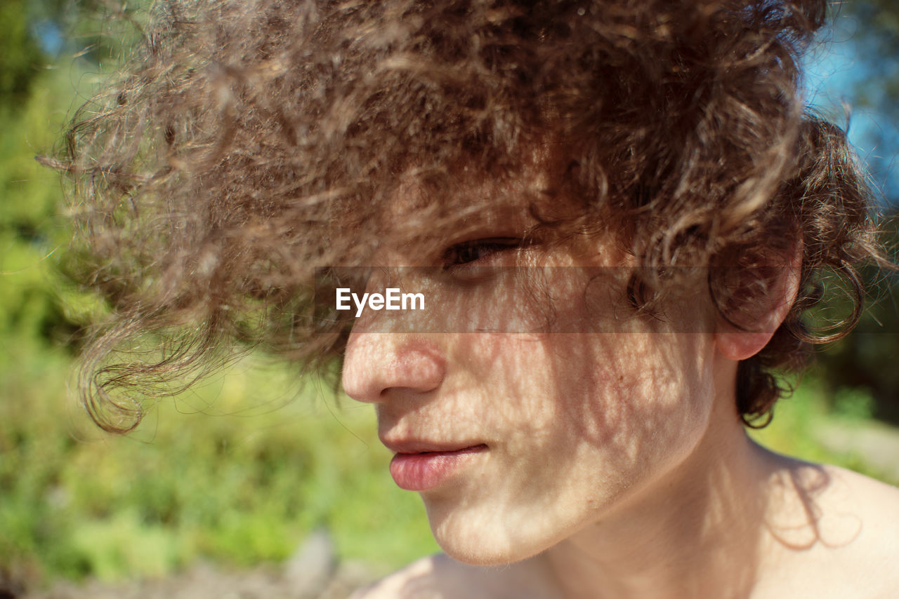 Close-up of young woman looking away