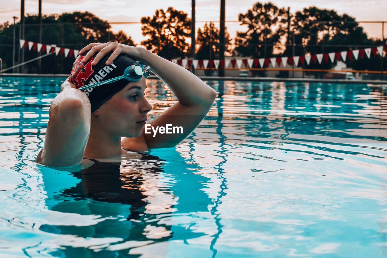 WOMAN SWIMMING IN POOL