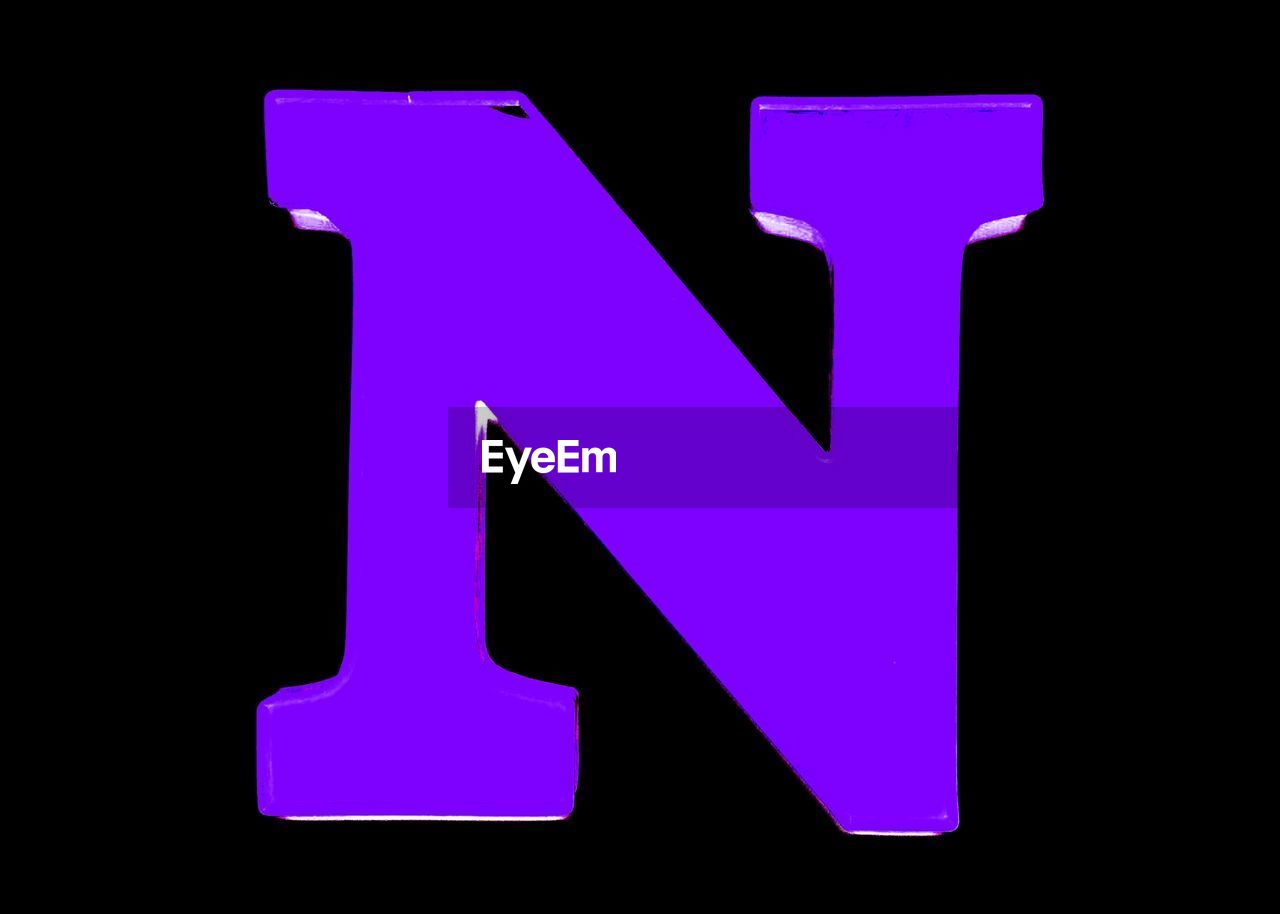 Close-up of letter n against black background