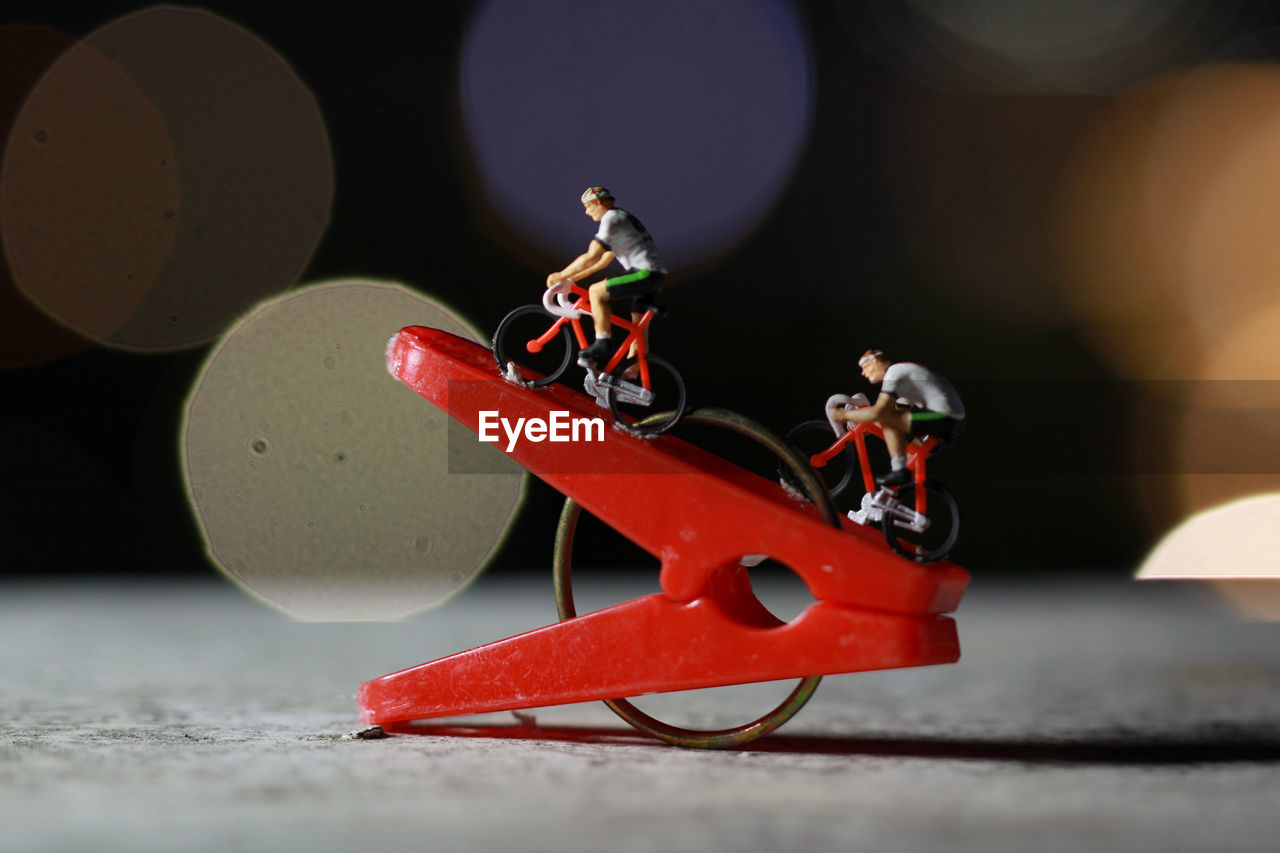 CLOSE-UP OF SMALL TOY ON TABLE AT BUS