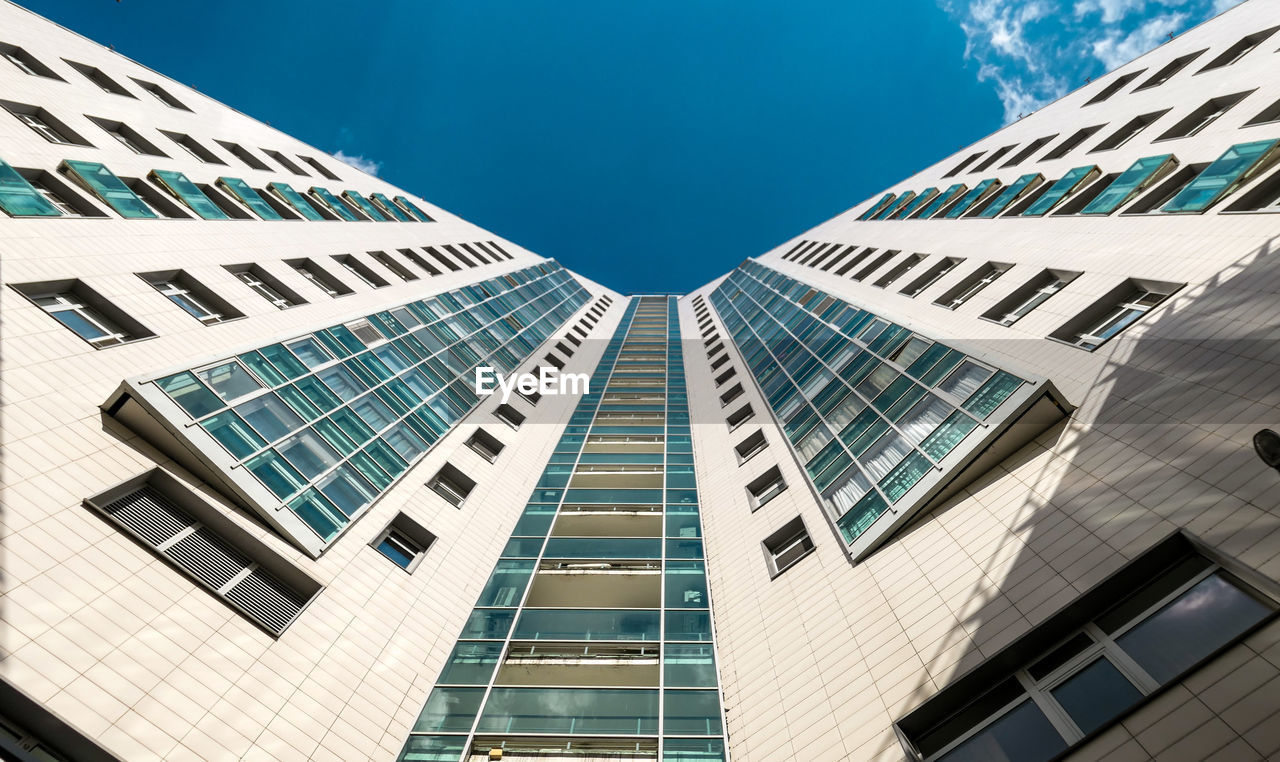 Sunny view of skyscraper external wall in moscow under blue sky in summer