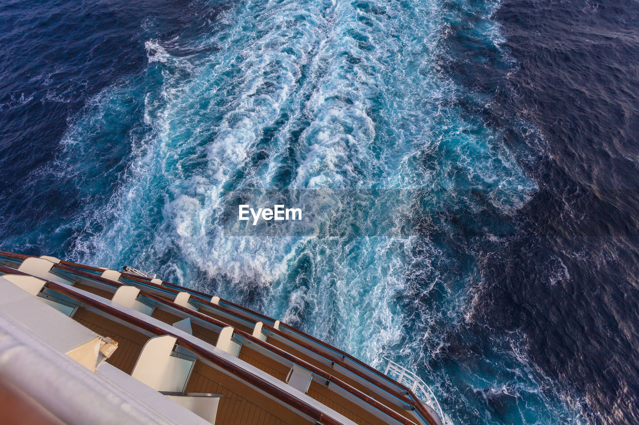 High angle view of ship sailing in sea with wake on the water