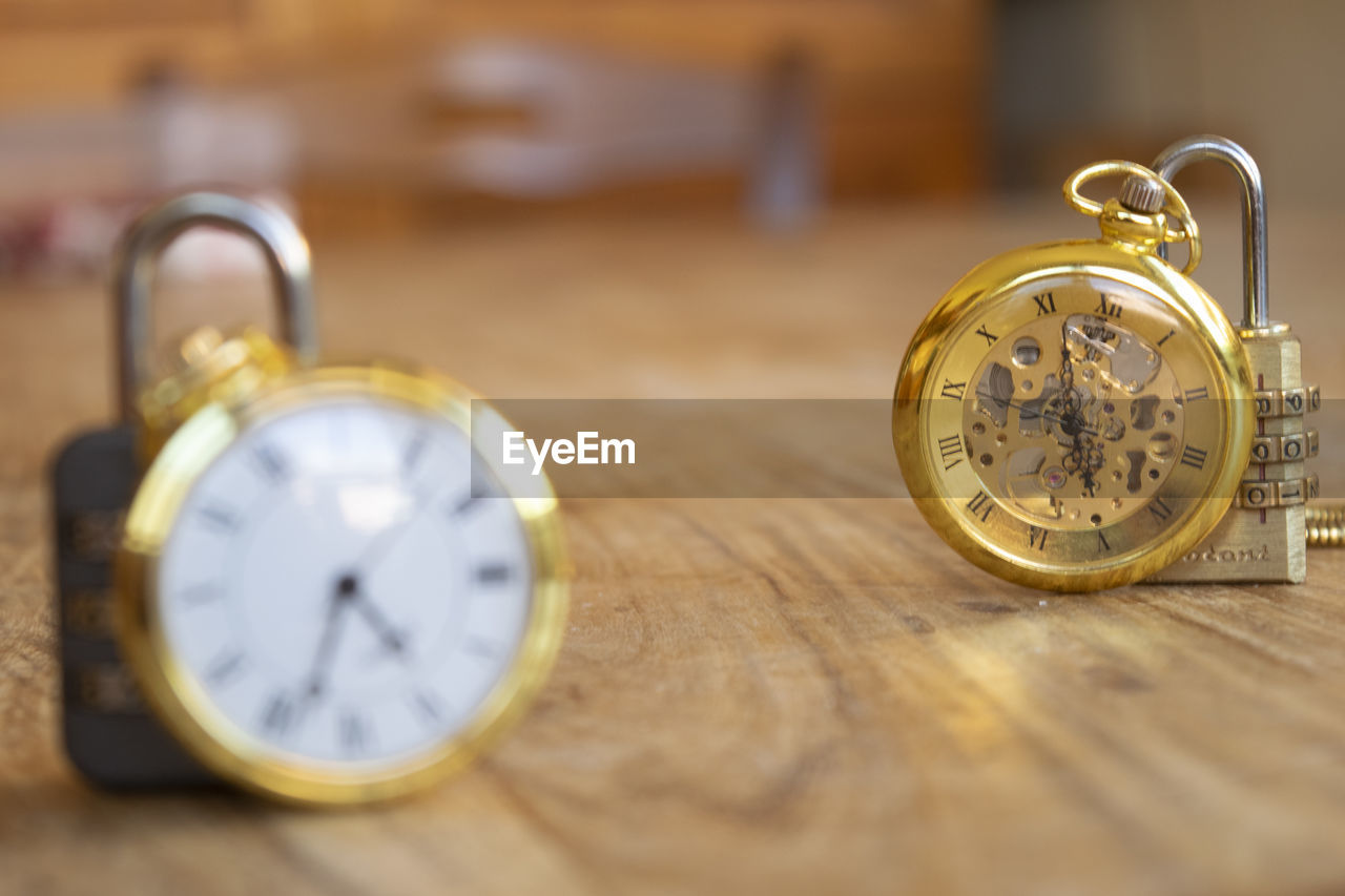 close-up of pocket watch on table