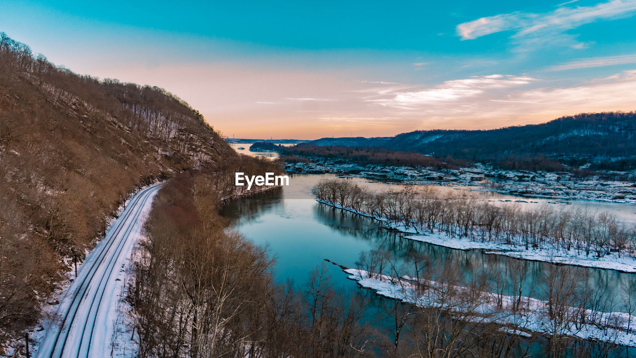 Scenic view of a river against sky during winter