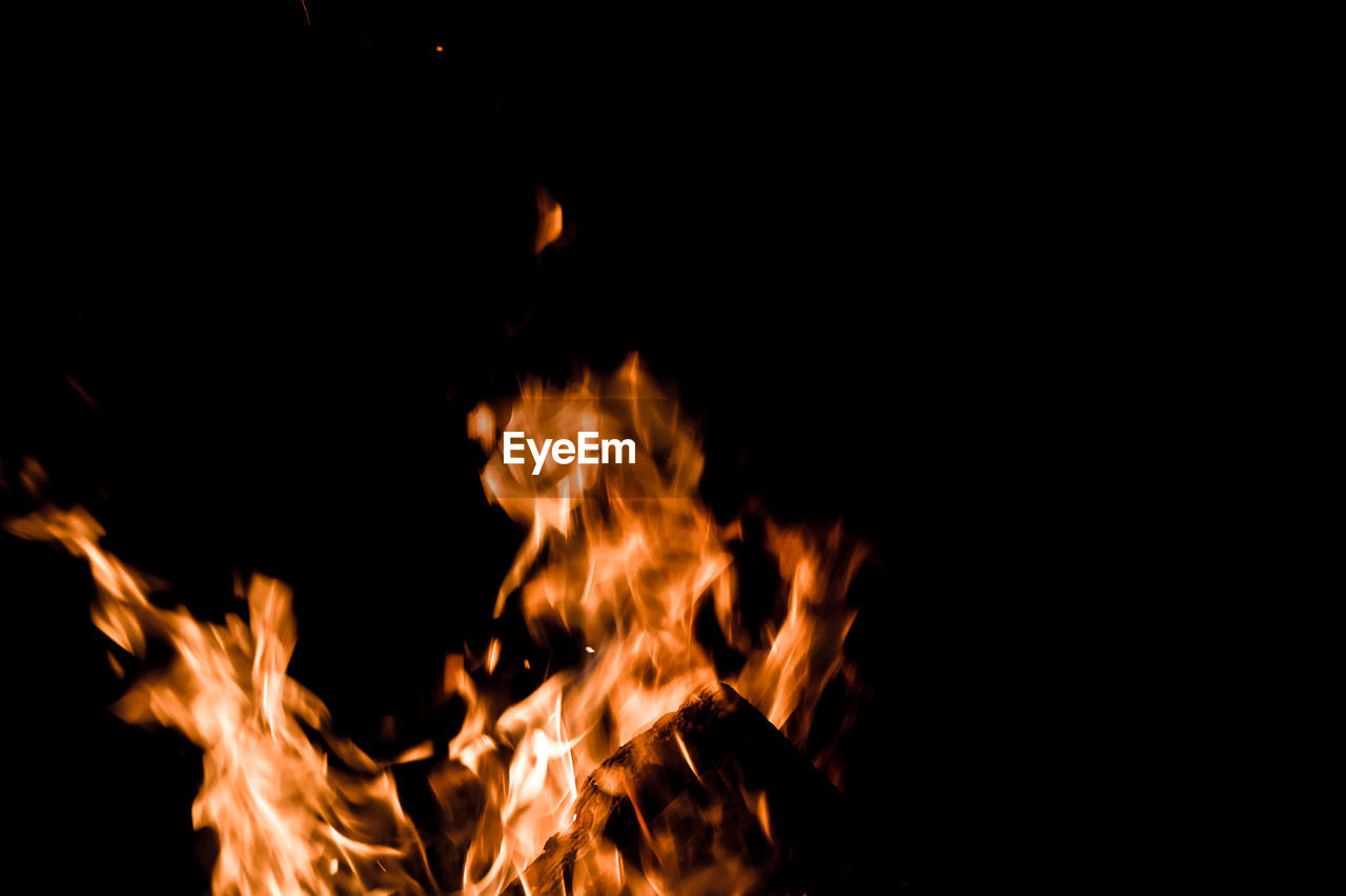 CLOSE-UP OF FIRE IN THE DARK